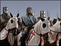 Men on horseback dressed as Crusaders
